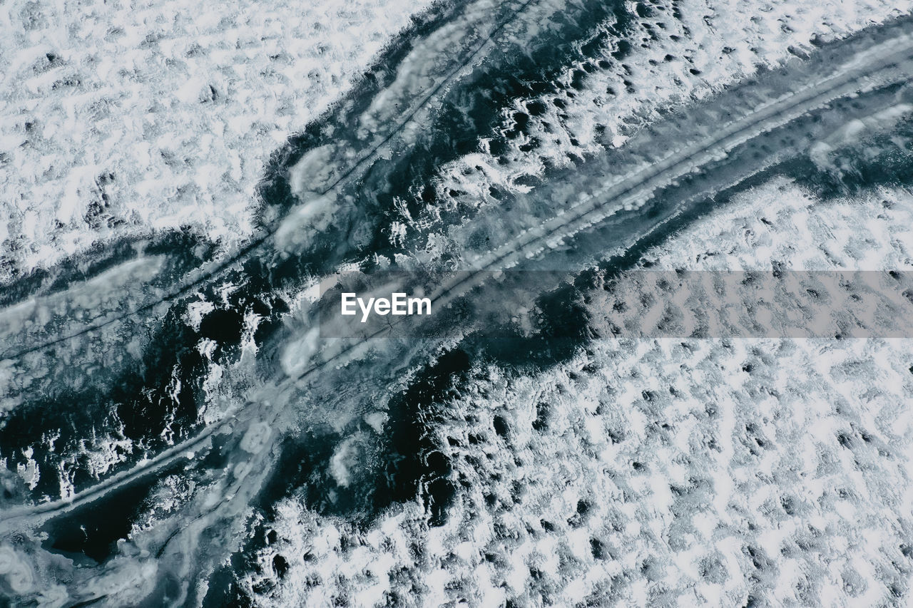 High angle view of snow covered lake and ice