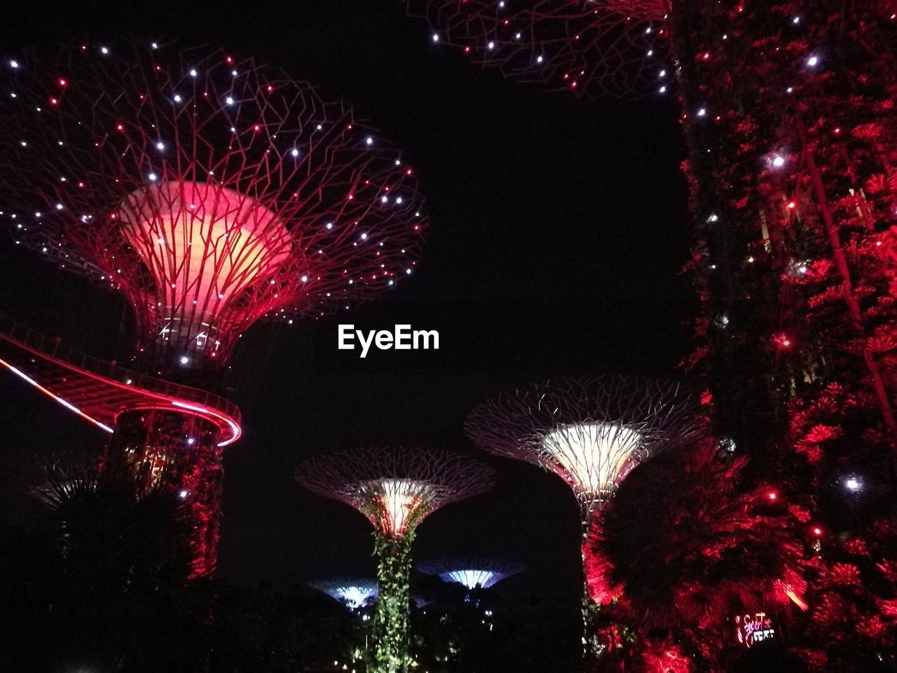 LOW ANGLE VIEW OF FIREWORKS DISPLAY AT NIGHT