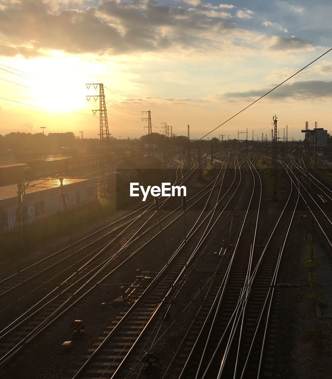 RAILROAD TRACKS AT SUNSET