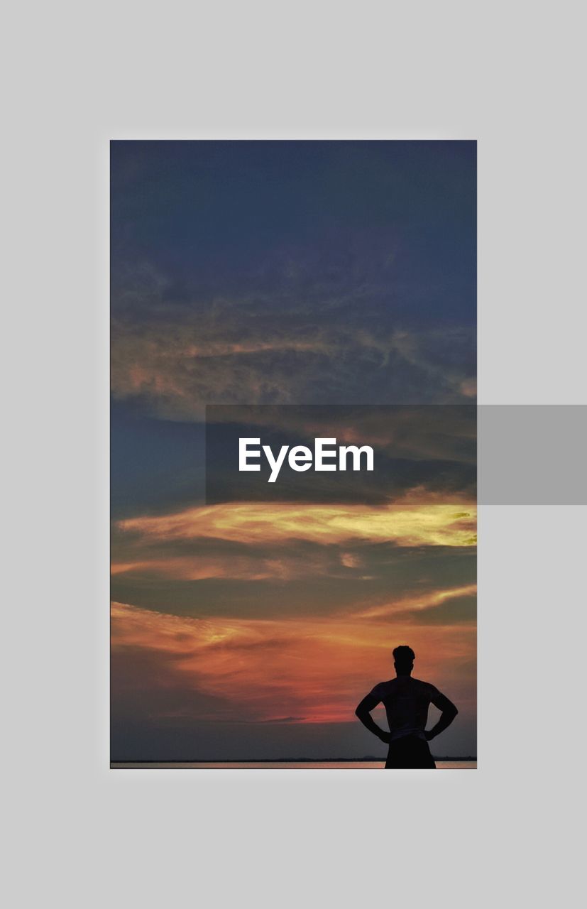 SILHOUETTE OF MAN AGAINST SKY