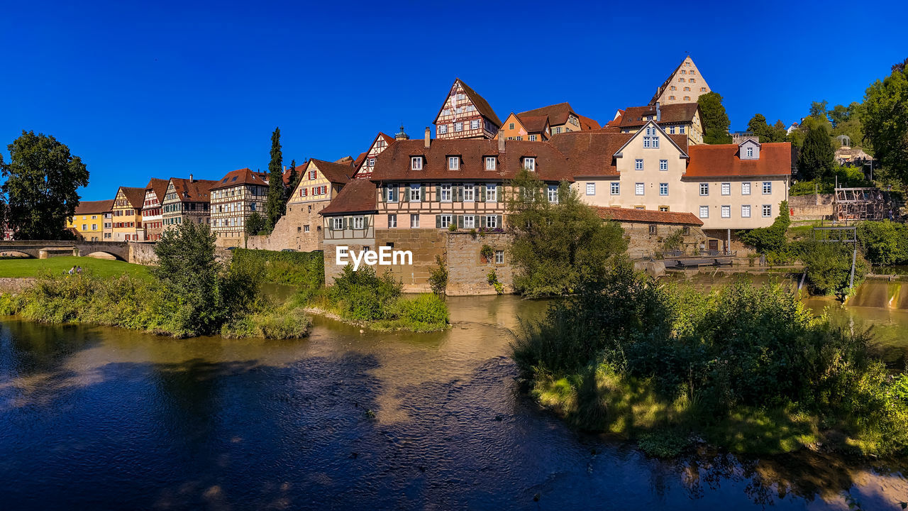 Panorama of the old town of schwaebisch hall with old half-timbered buildings seen from river kocher