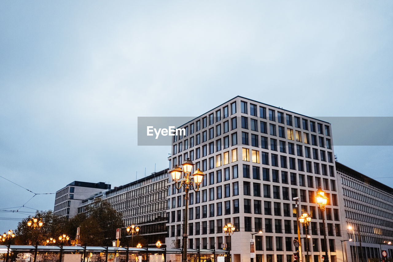 Low angle view of illuminated building against sky at night