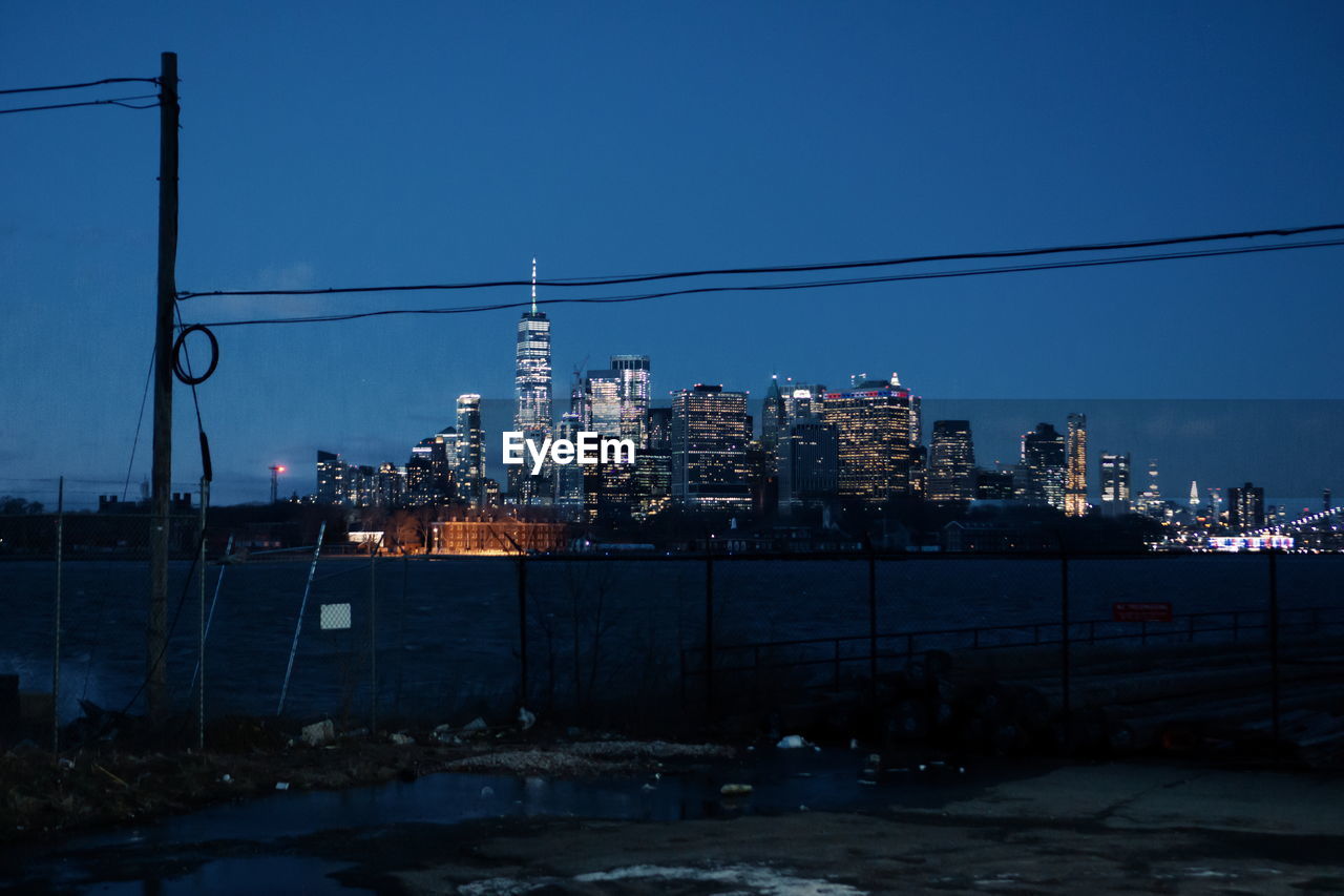 Illuminated new york city against sky during winter