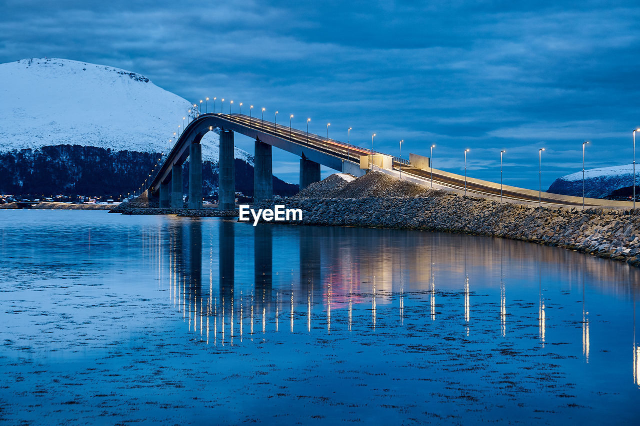 Lepsøyrevet lighthouse with lepsøy bridge in the background, haramsøya, Ålesund, norway.