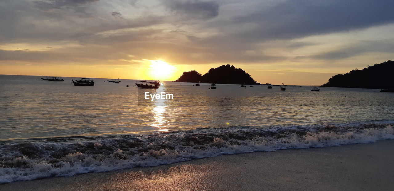 SCENIC VIEW OF SEA DURING SUNSET