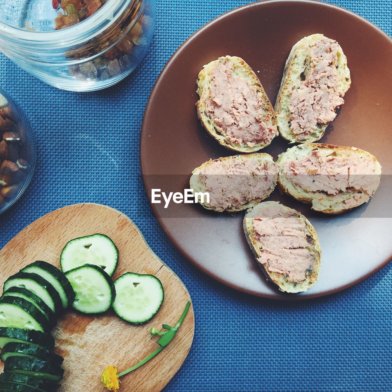 High angle view of pate and sliced cucumber on table