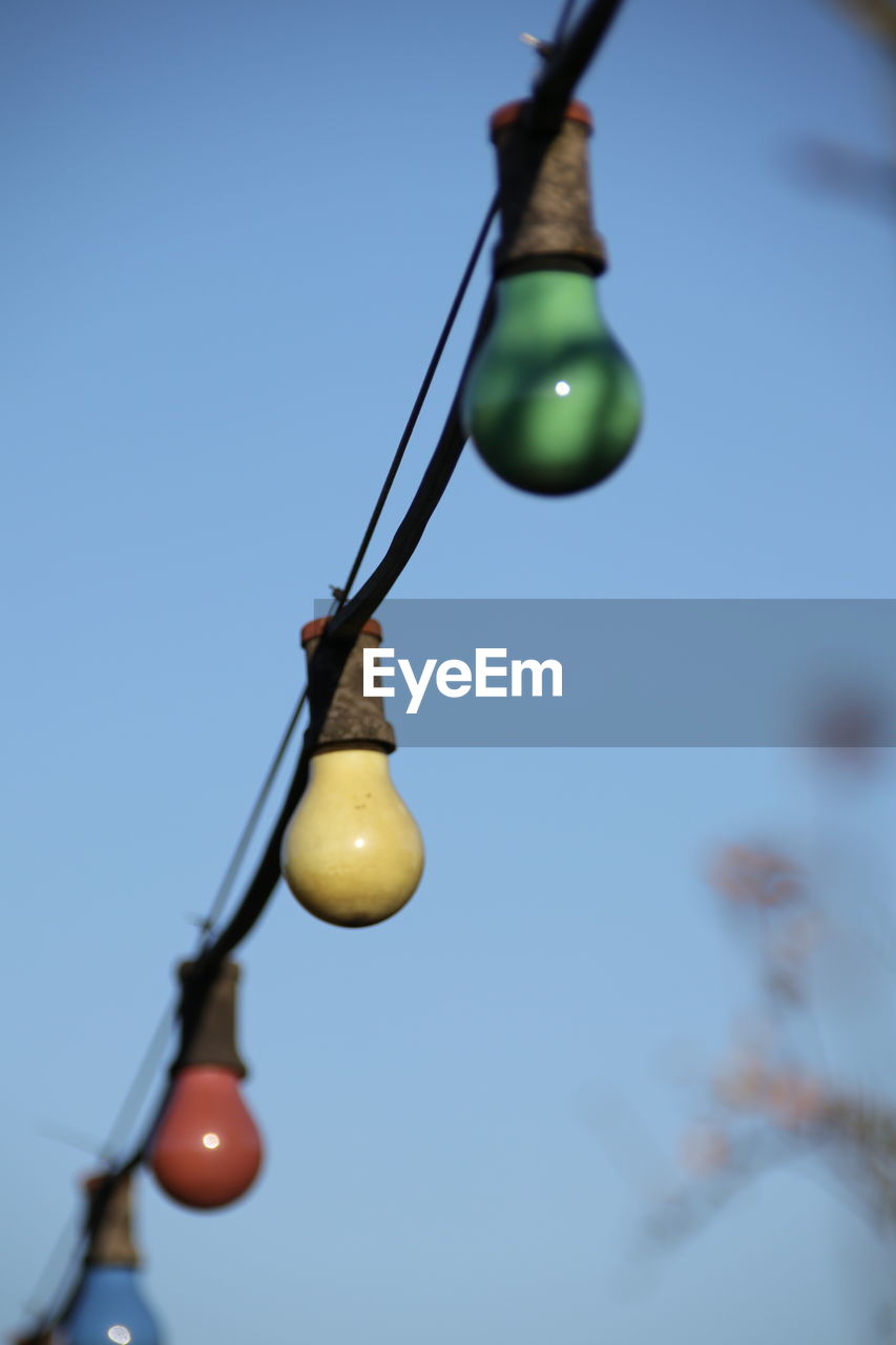 LOW ANGLE VIEW OF ELECTRIC LAMP AGAINST SKY
