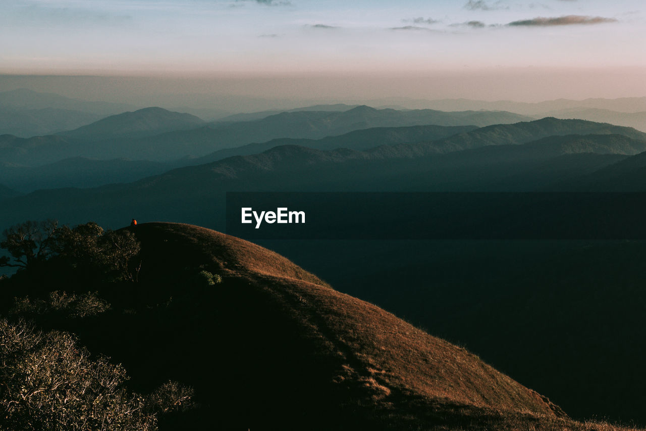 Scenic view of mountains against sky during sunset