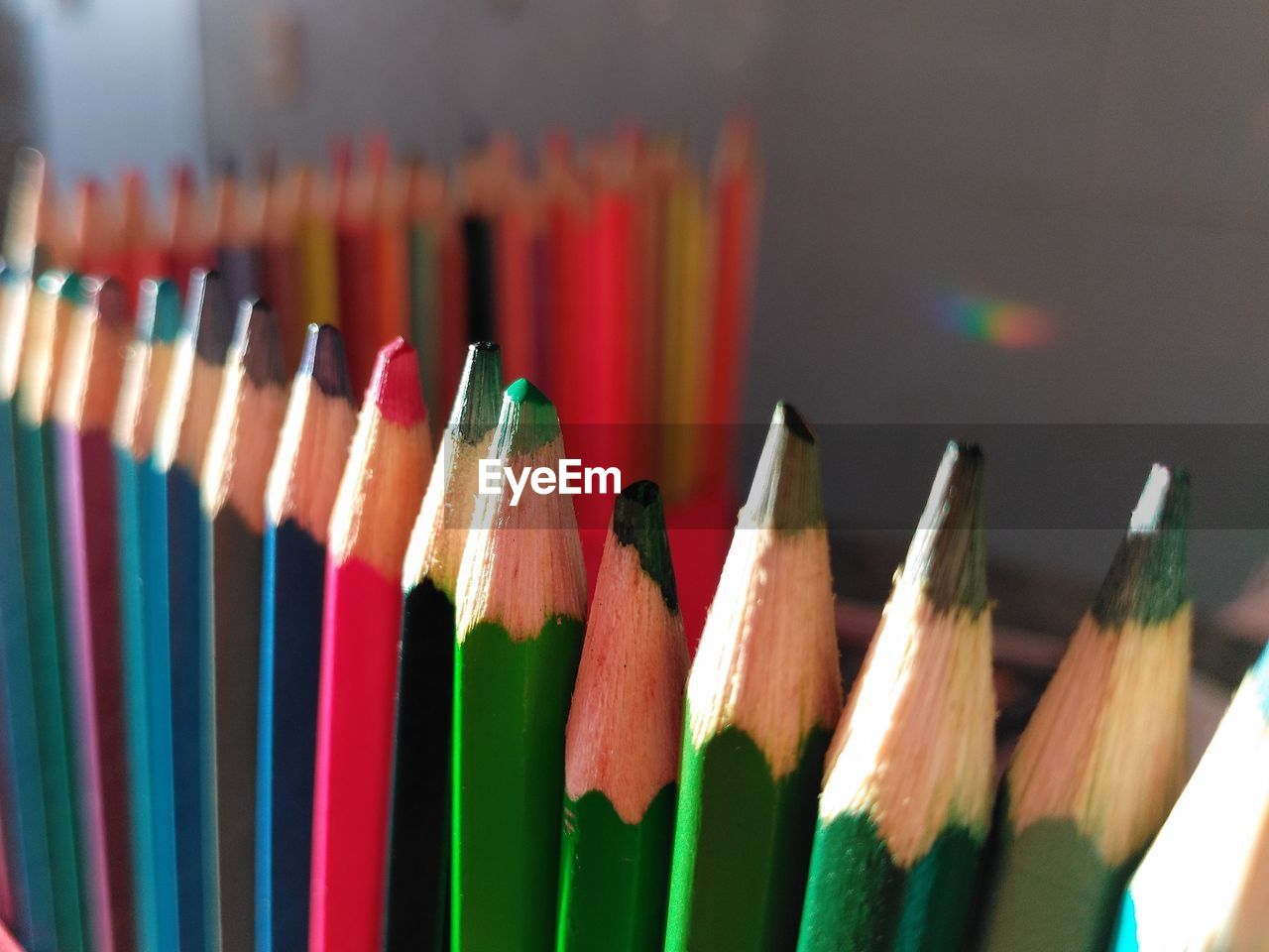 A row of colorful pencils