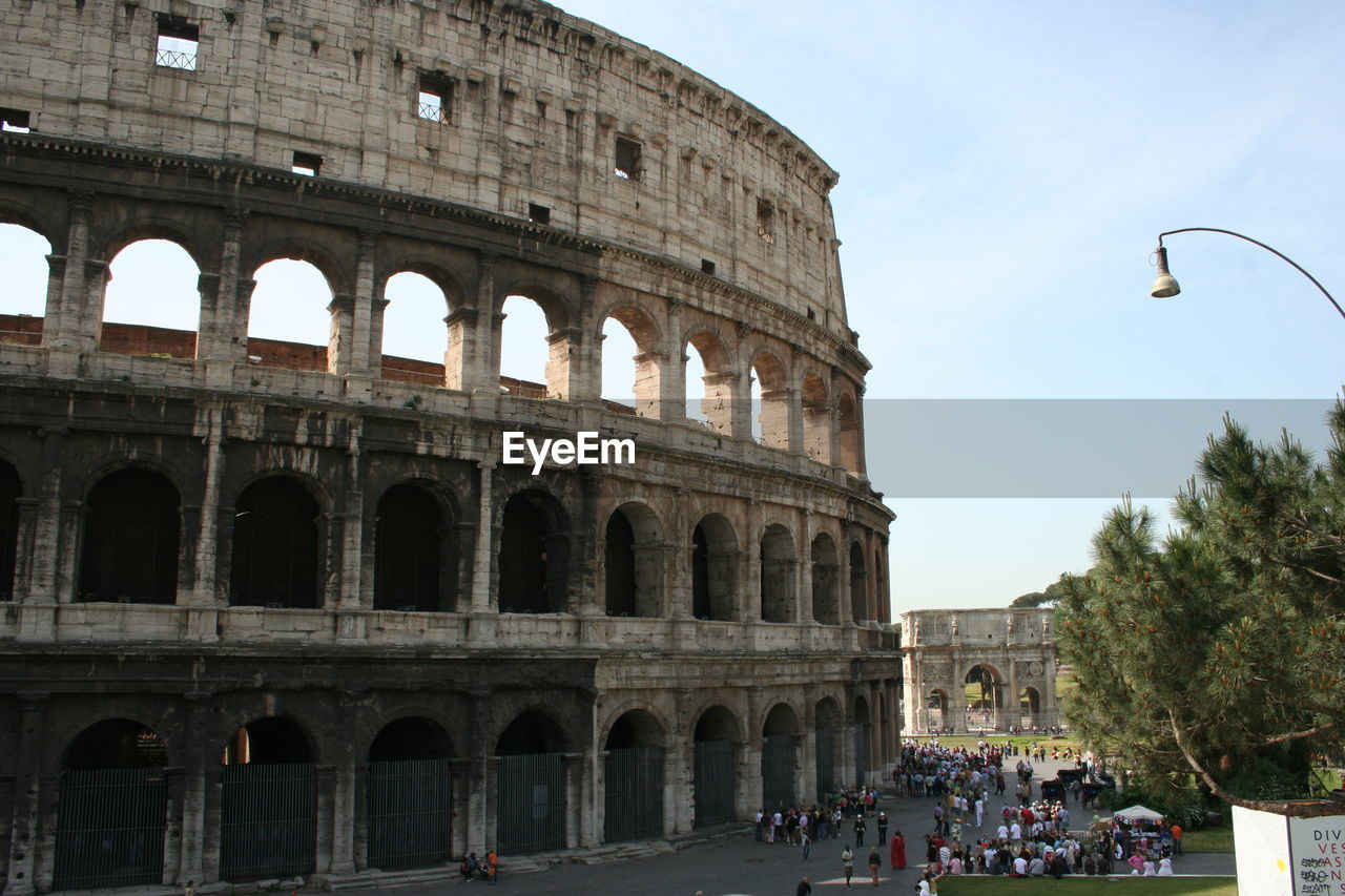 Low angle view of coliseum against sky