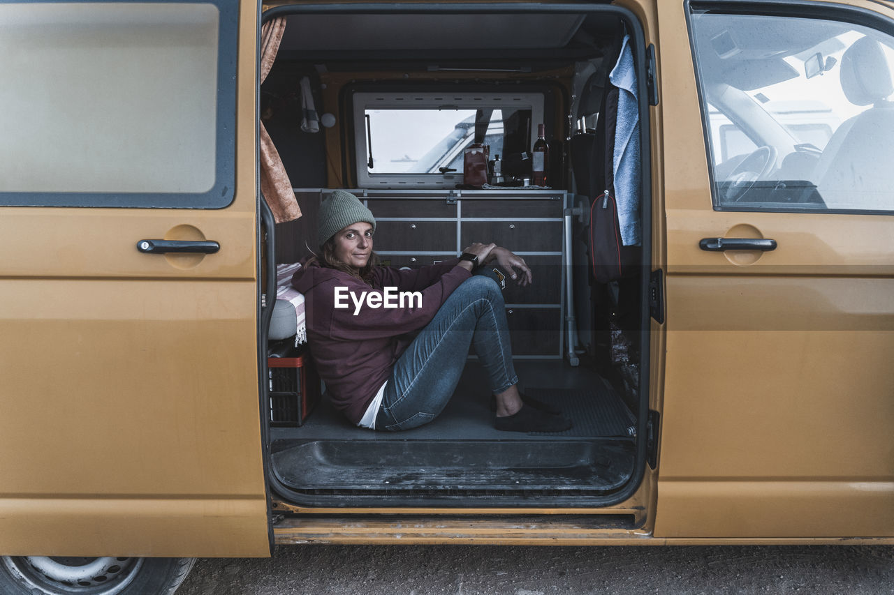 Surfing girl lifestyle in her van