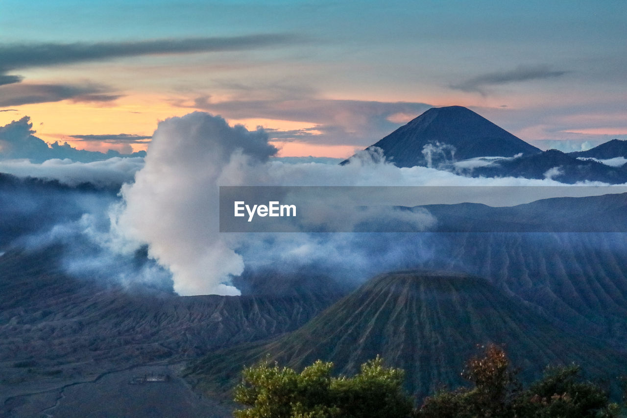 Scenic view of volcanic bromo mountain against sky during sunset