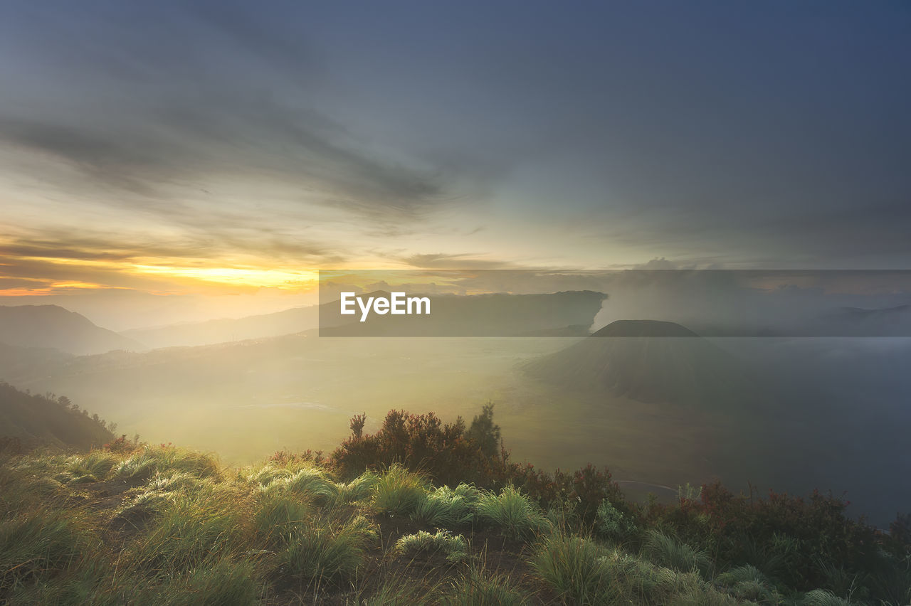 Scenic view of mountains against sky during sunset