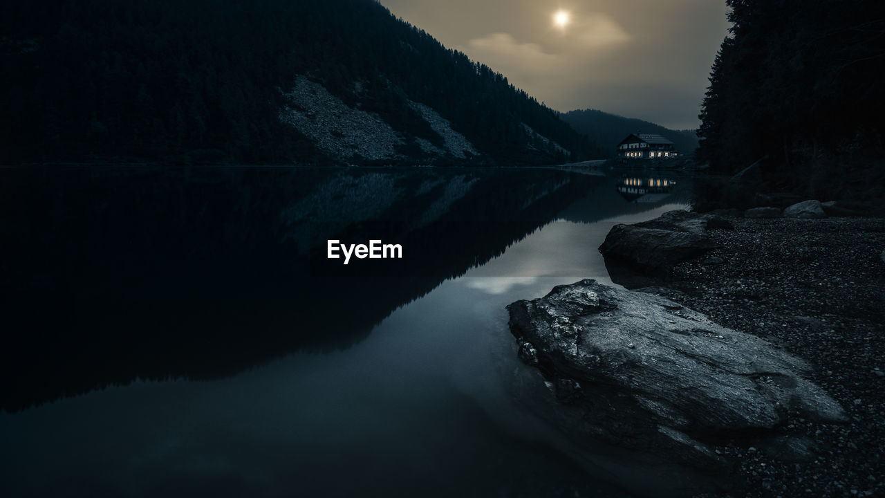 Reflection of mountain in lake against sky