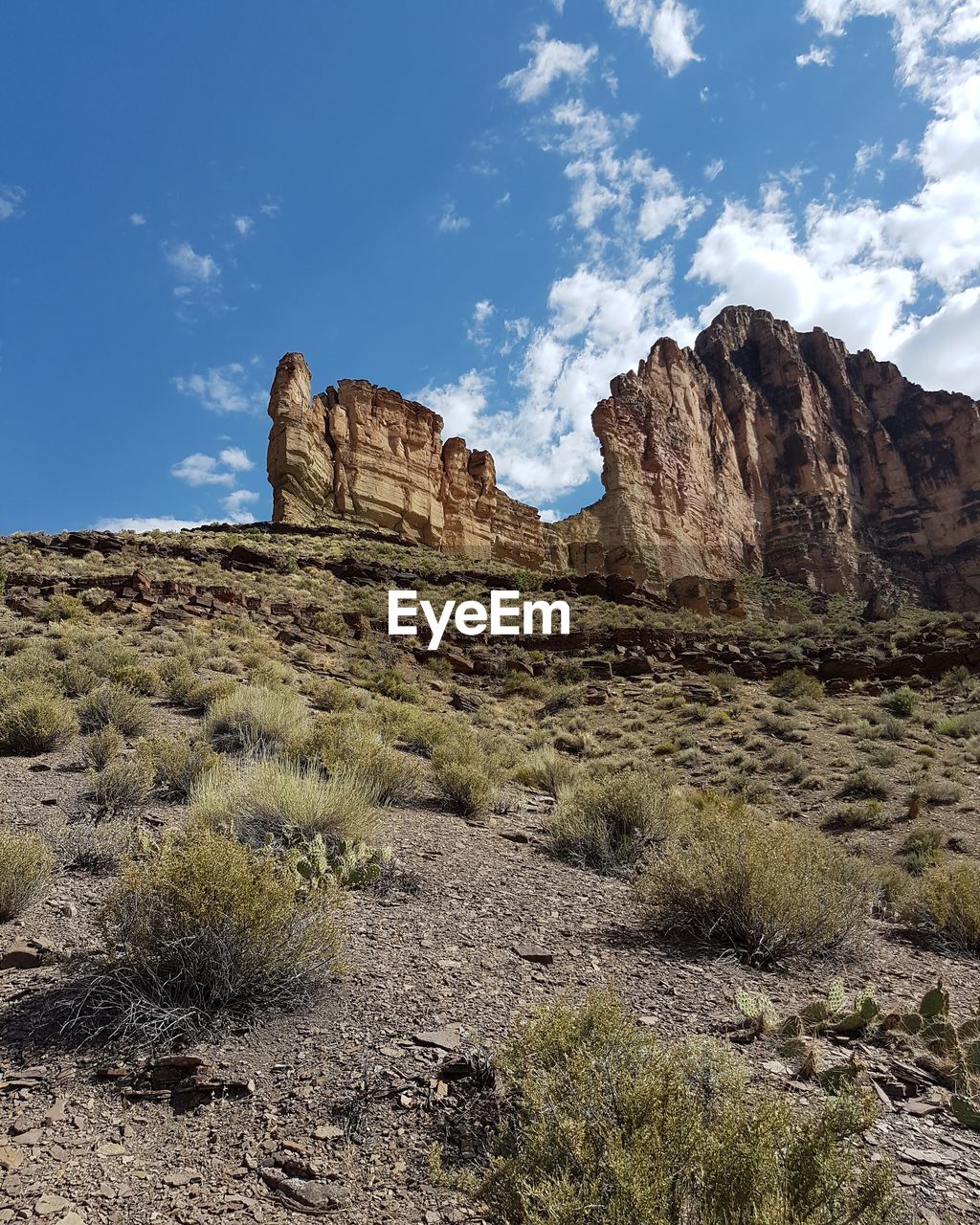 Rock formations on landscape against sky