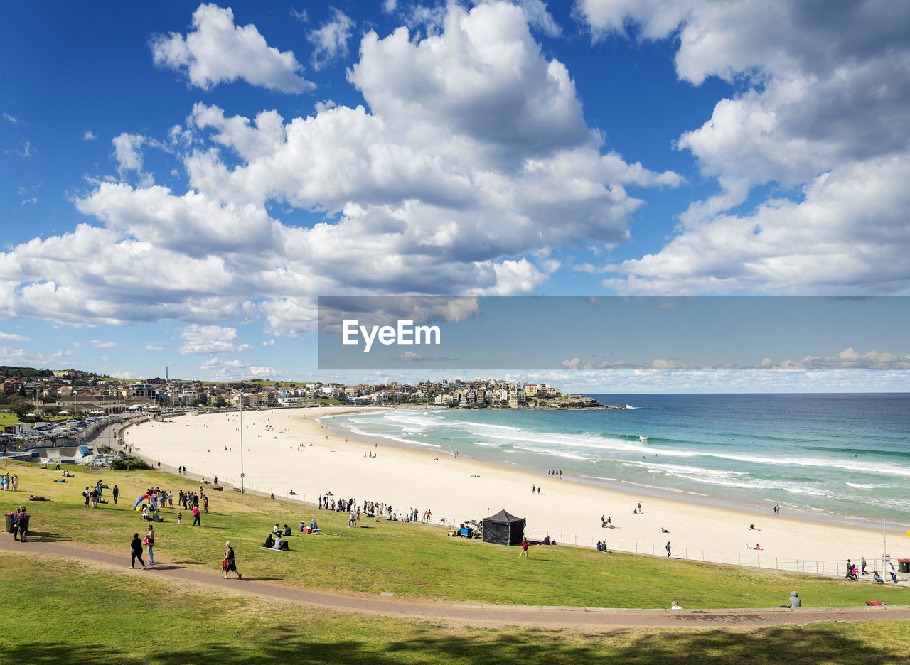 High angle view of people at beach against sky