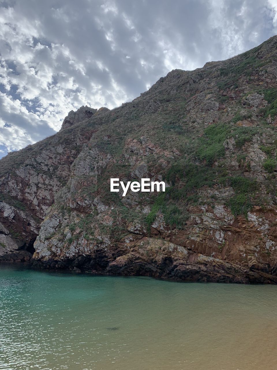 nature, cloud, terrain, water, day, beauty in nature, rock, sky, no people, outdoors, scenics - nature, cliff, land, blue, sea, environment, tranquility, reflection, mountain, beach, plant, high angle view