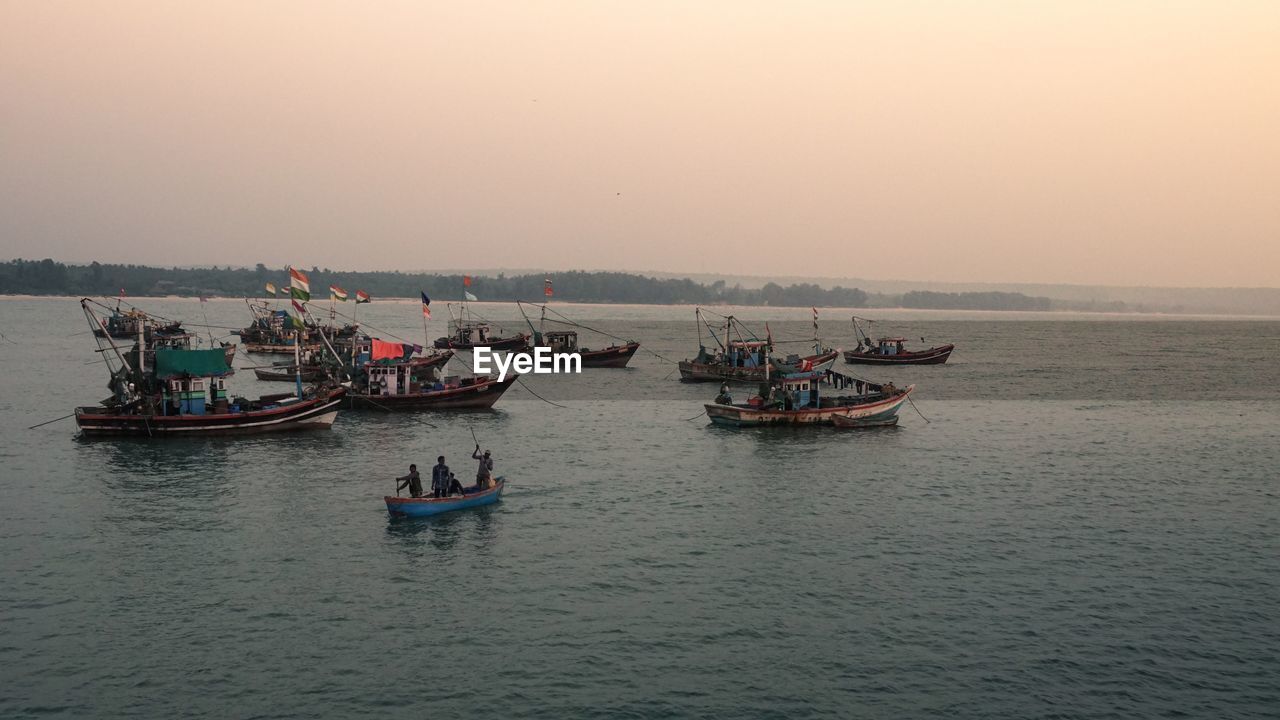 Boats and fishermen sunset time vengurla beach 