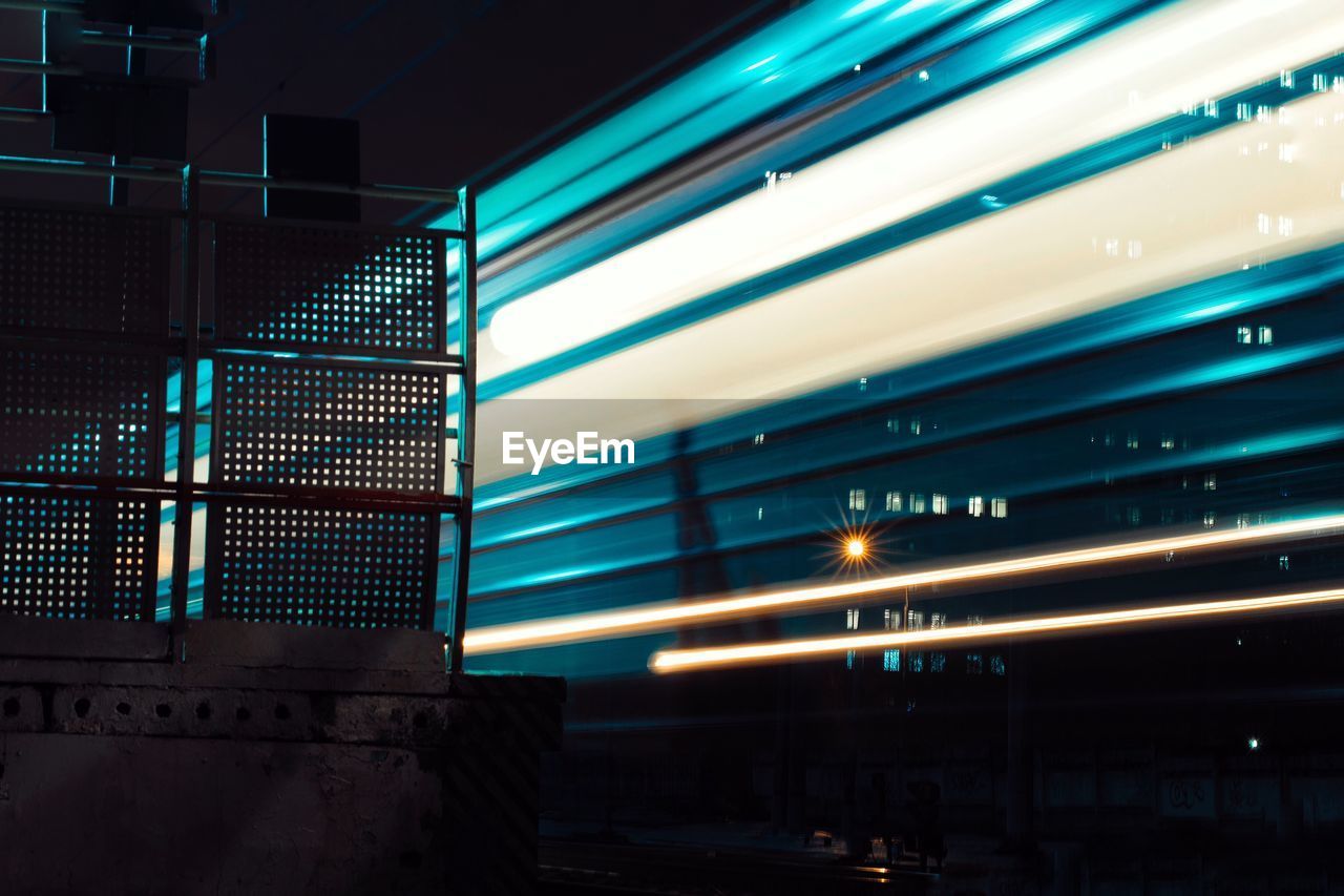 Blurred motion of train at railroad station at night