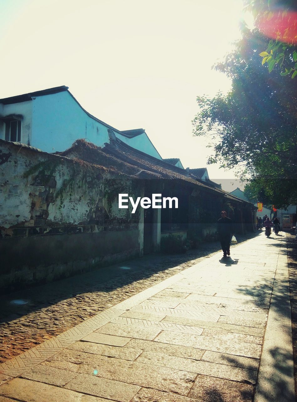 WOMAN WALKING IN CITY