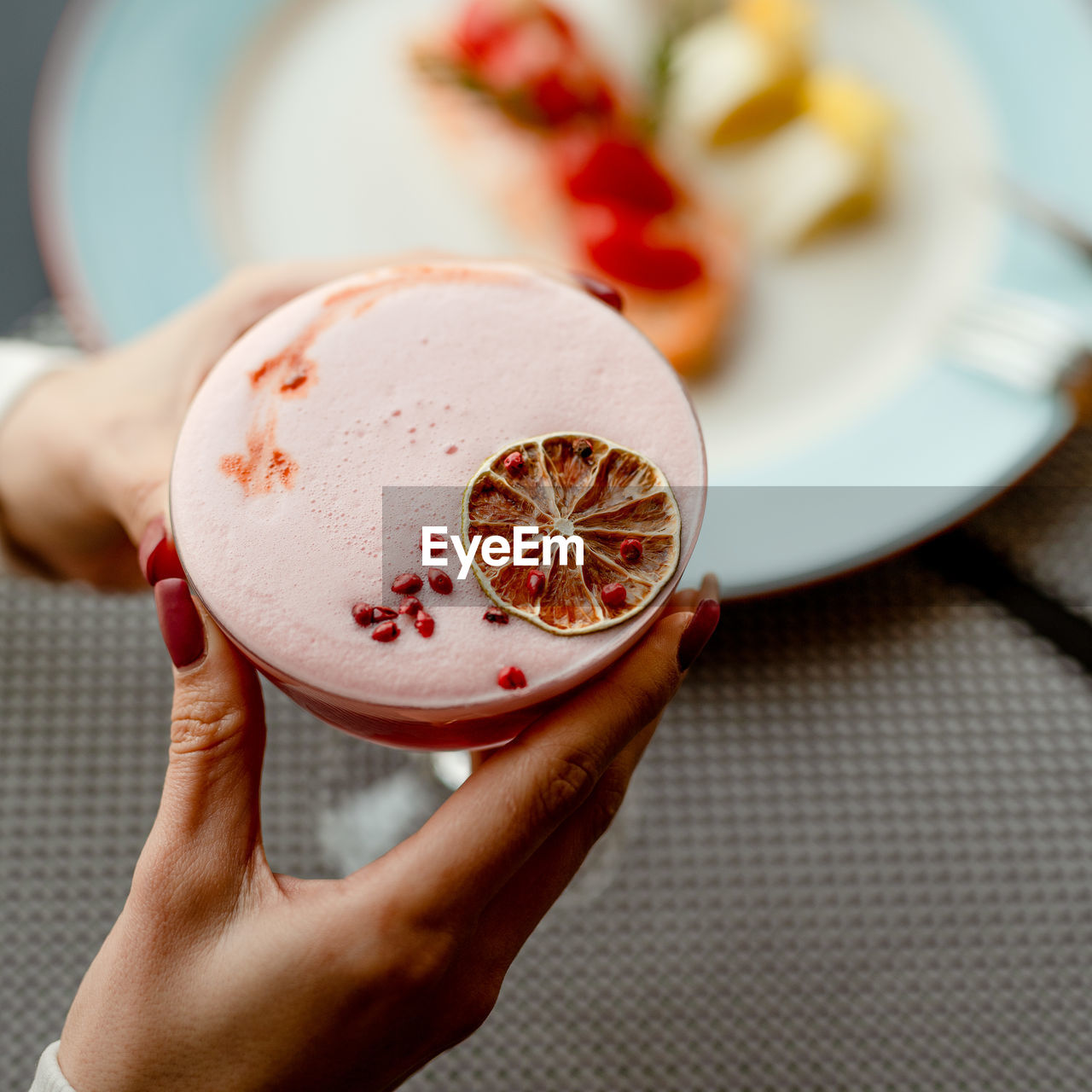 cropped hands of person holding dessert