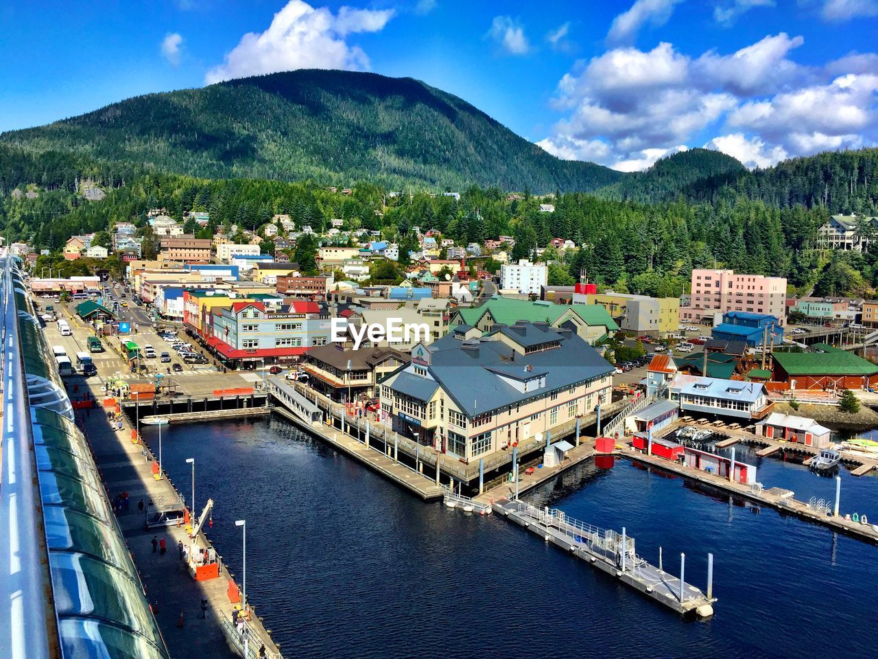 High angle view of townscape by river against sky