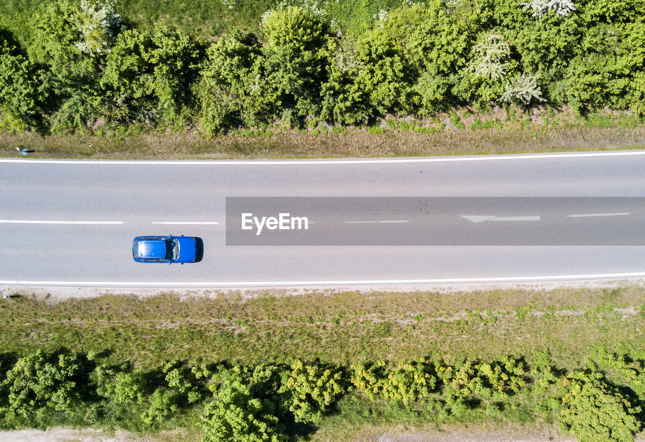 Car on road amidst field