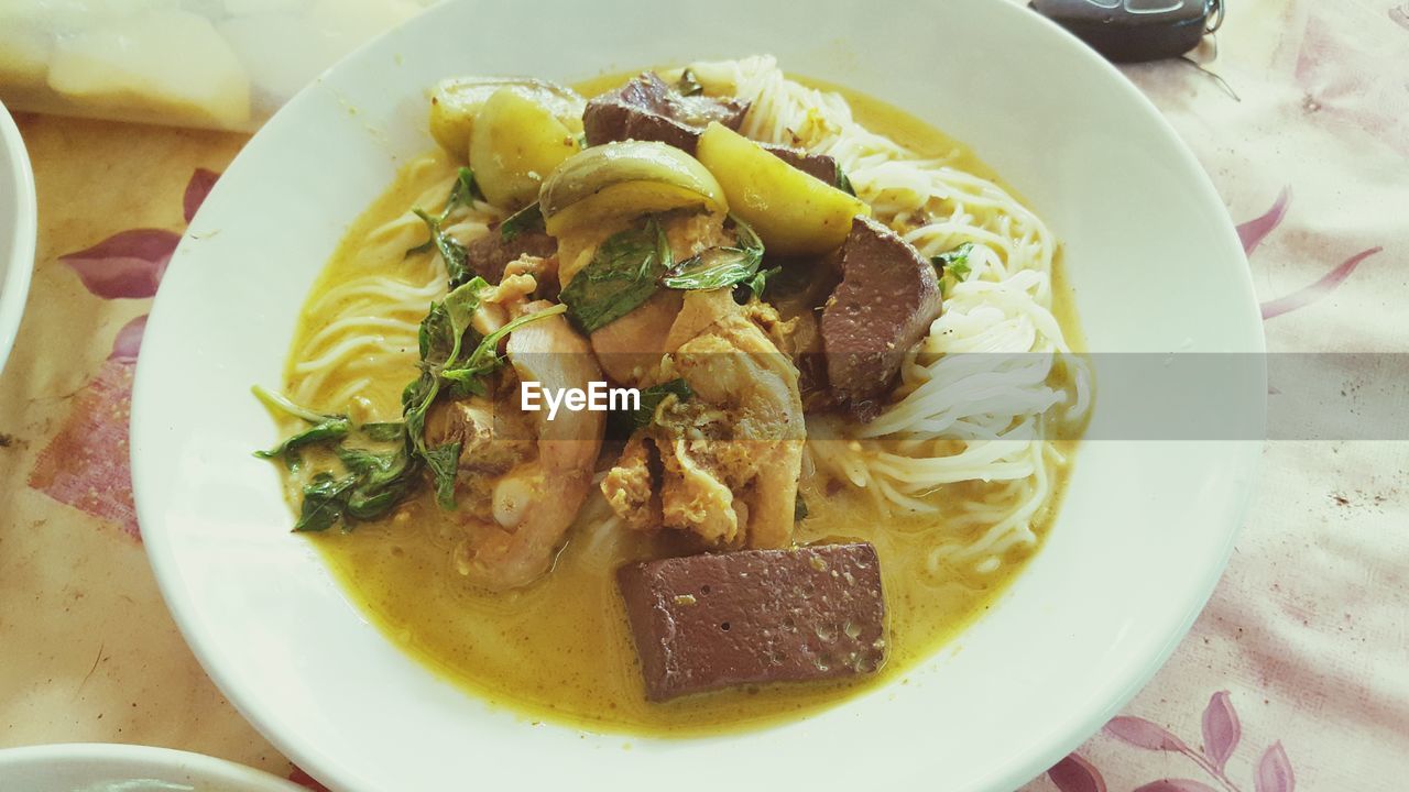 food and drink, food, healthy eating, freshness, pasta, dish, wellbeing, italian food, plate, table, indoors, cuisine, serving size, high angle view, bowl, meal, no people, meat, vegetable, still life, close-up, asian food, soup, noodle soup, curry, restaurant