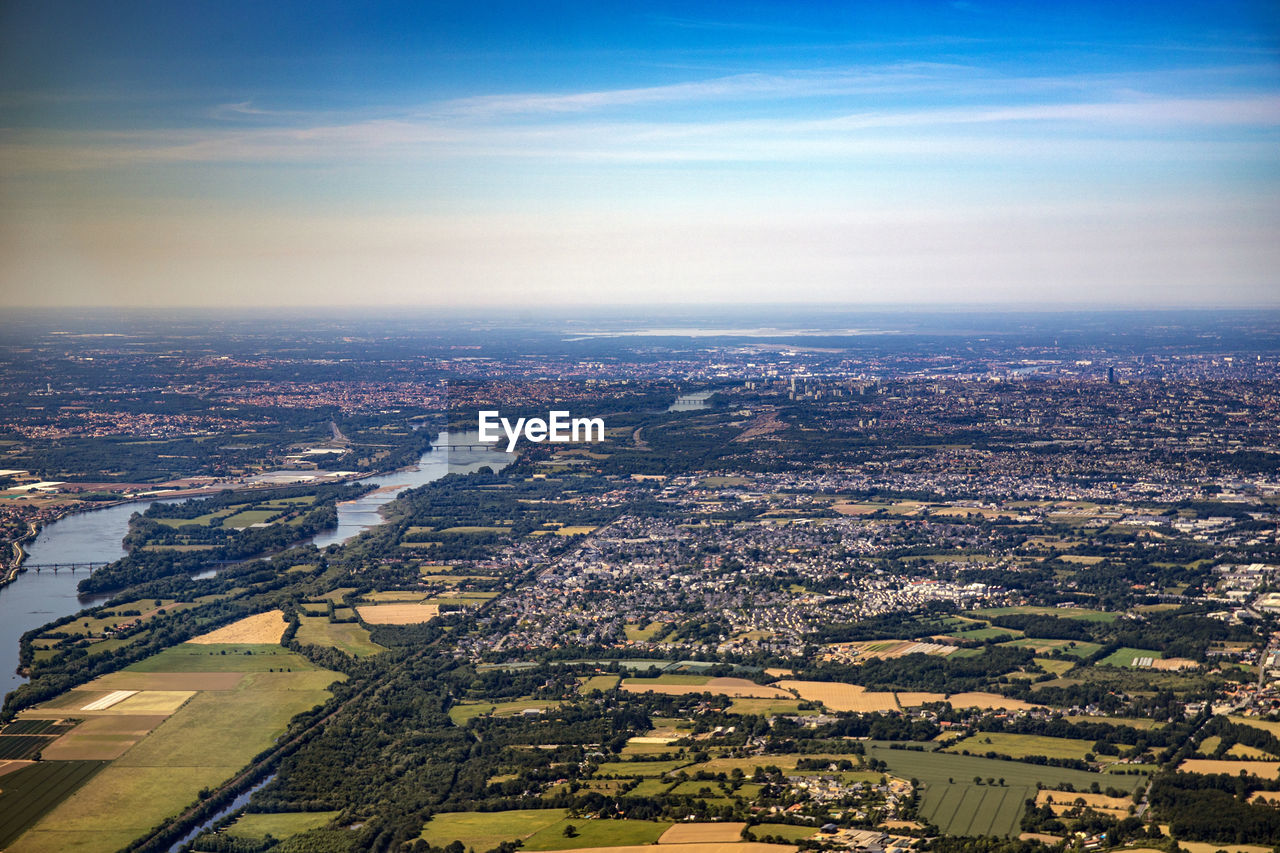 AERIAL VIEW OF CITY AGAINST SKY