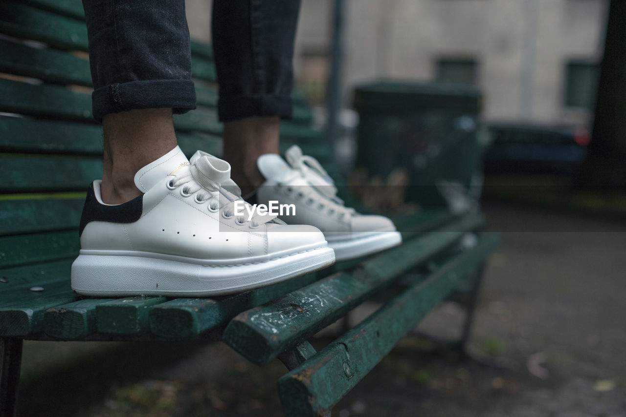 Man wearing a pair of alexander mcqueen sneakers in the street