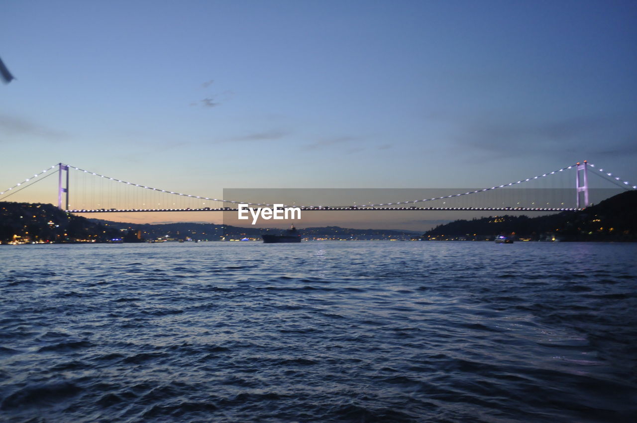 SUSPENSION BRIDGE OVER RIVER WITH BRIDGE