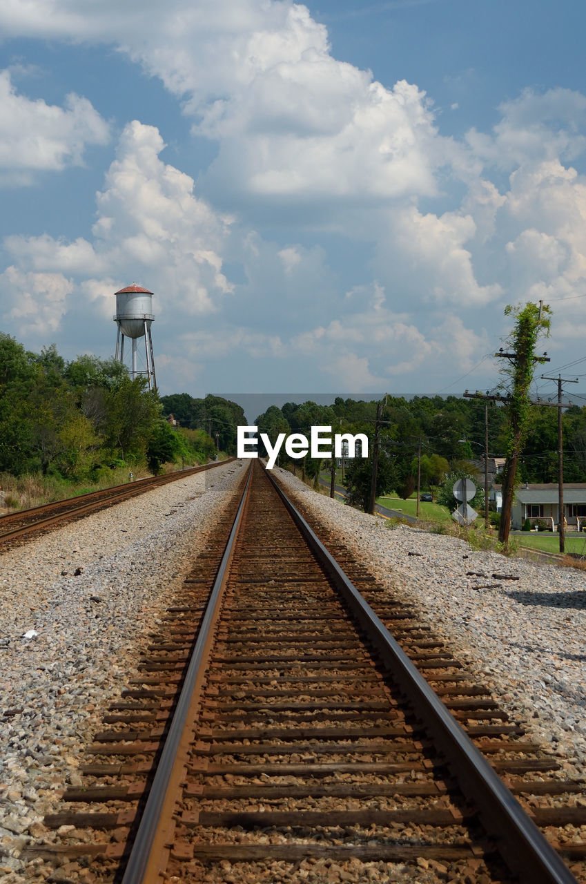 View of railroad tracks against cloudy sky