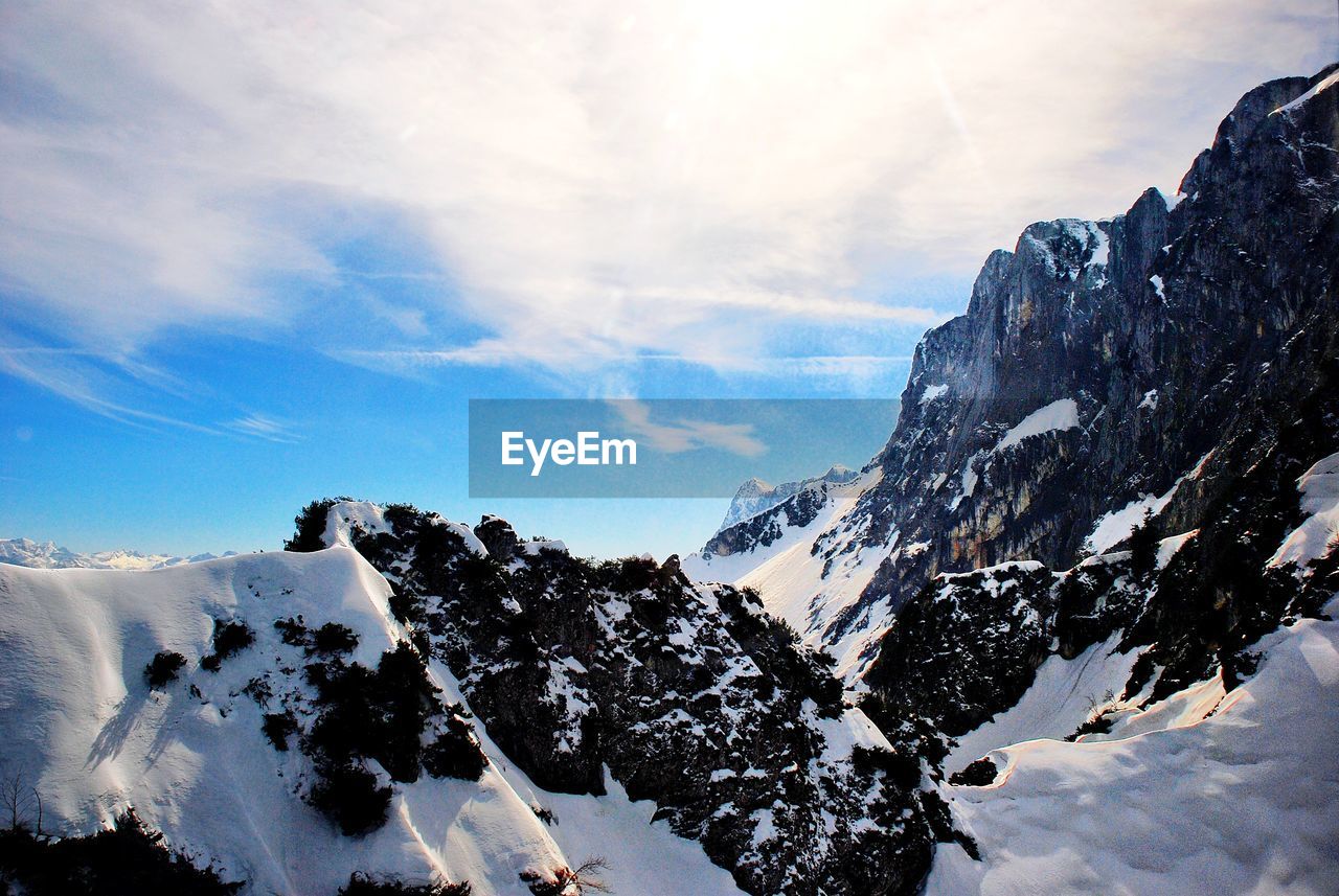 Scenic view of snowcapped mountains against sky