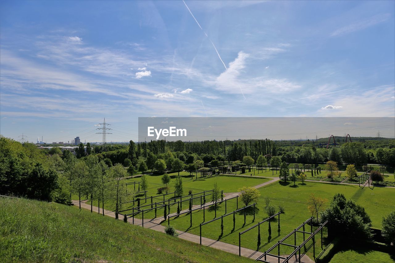 PANORAMIC VIEW OF GREEN LANDSCAPE AGAINST SKY