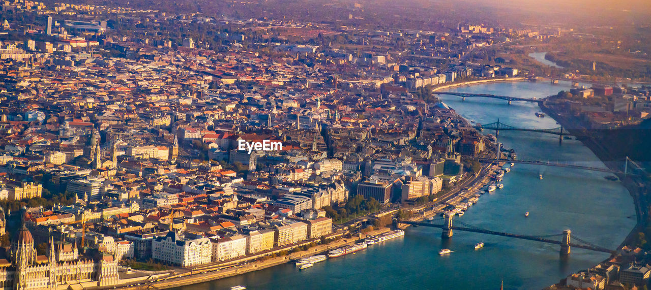 HIGH ANGLE VIEW OF CITY BUILDINGS AT WATERFRONT