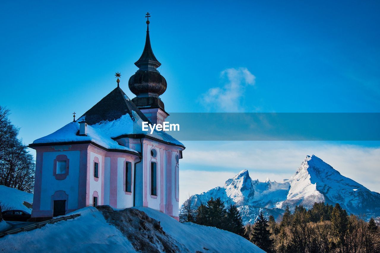 CHURCH AGAINST MOUNTAIN RANGE