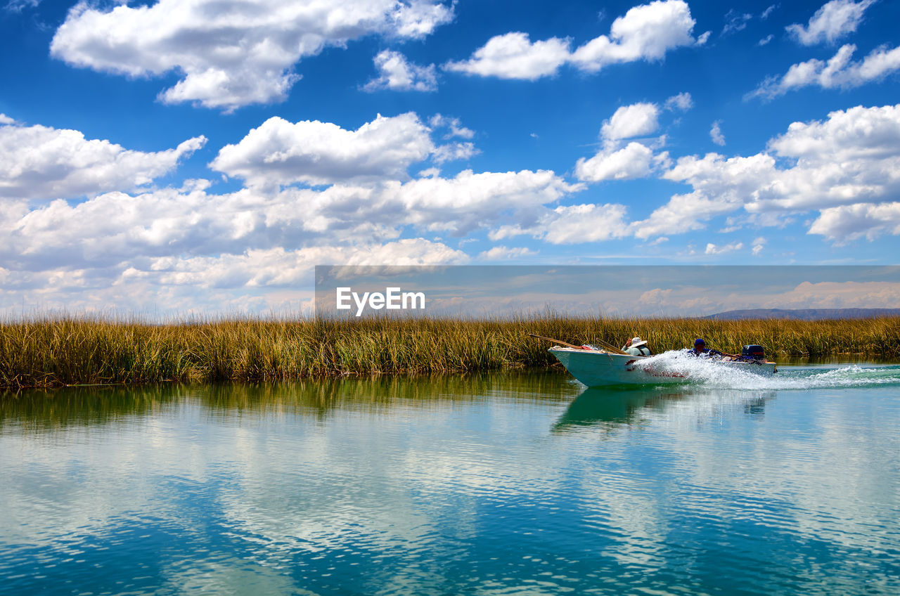 View of boat in lake titicaca  against sky