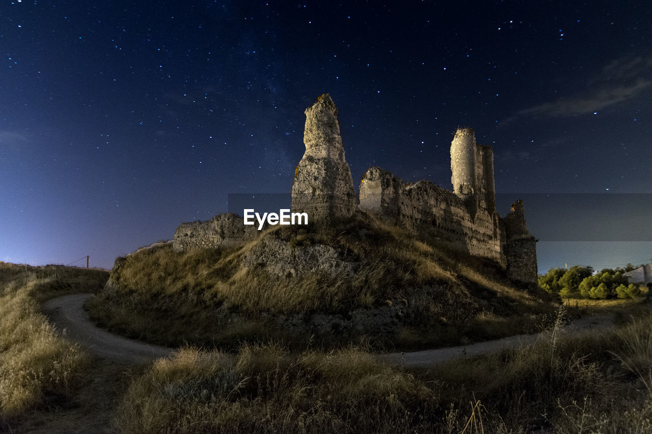 Old building against sky at night