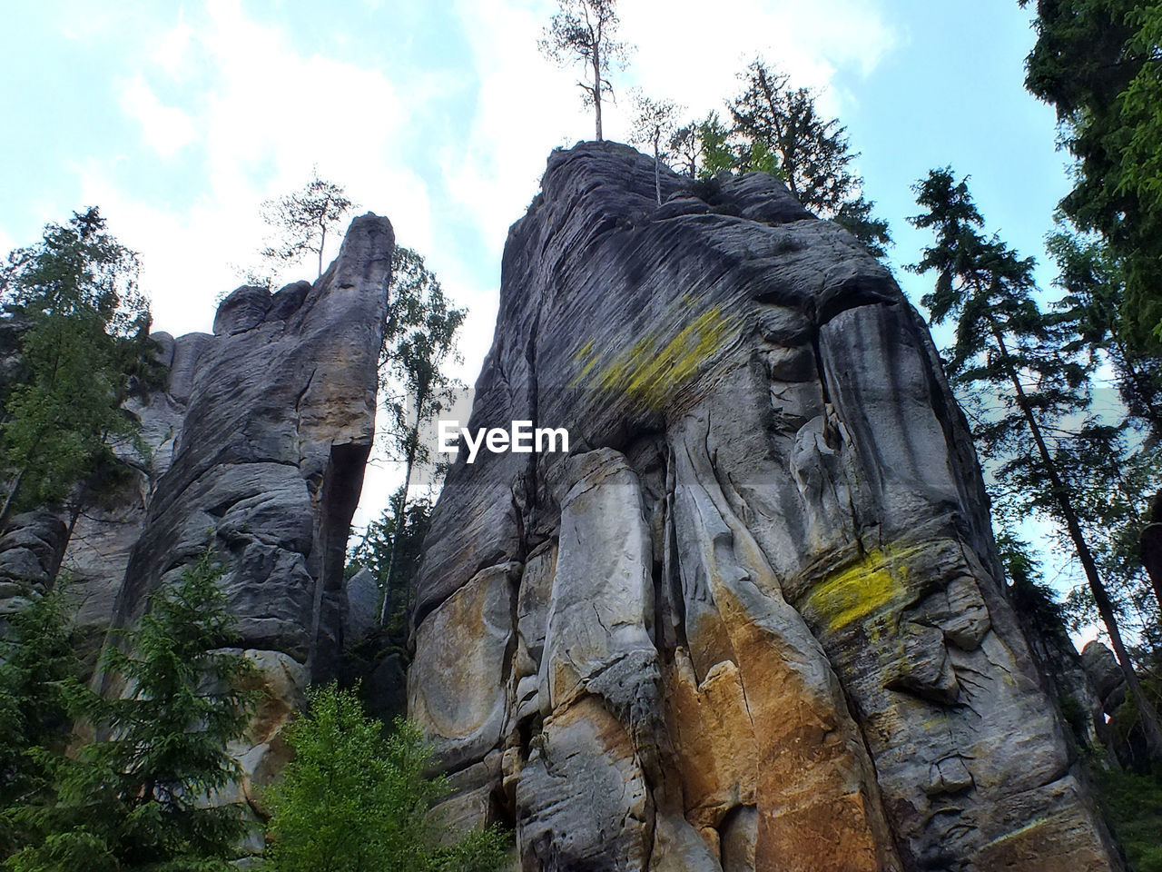 LOW ANGLE VIEW OF STATUE ON ROCK FORMATION