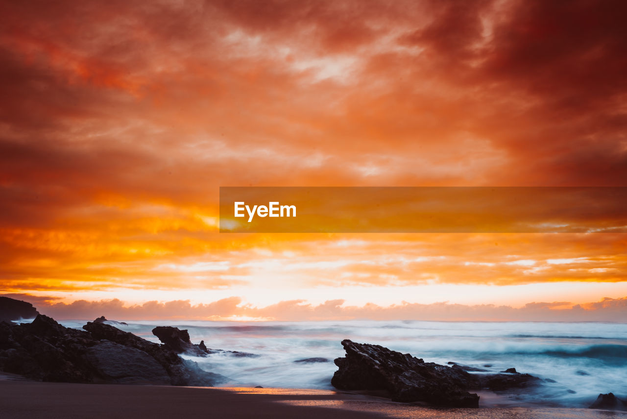 Scenic view of sea against sky during sunset