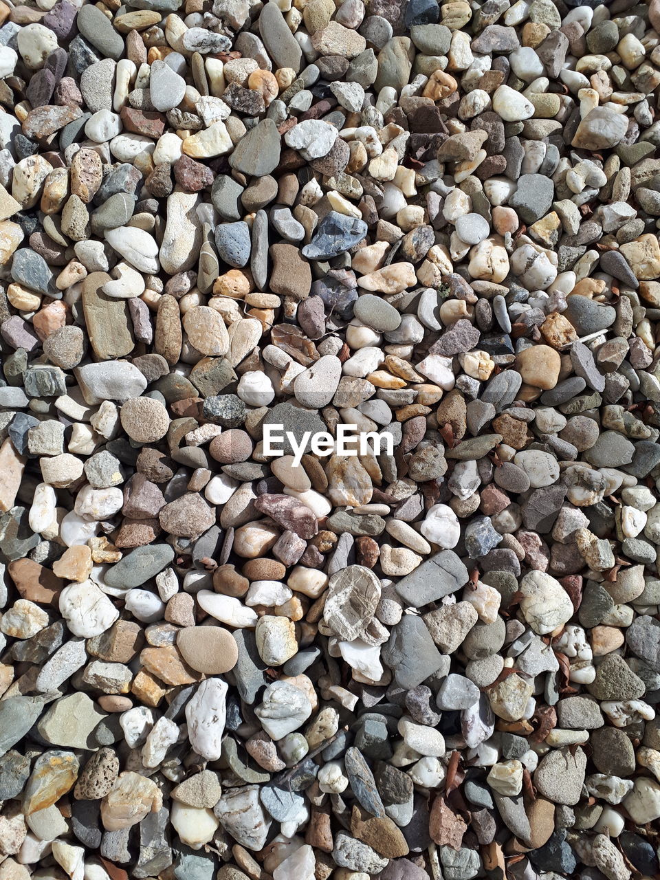 Full frame shot of pebbles on beach