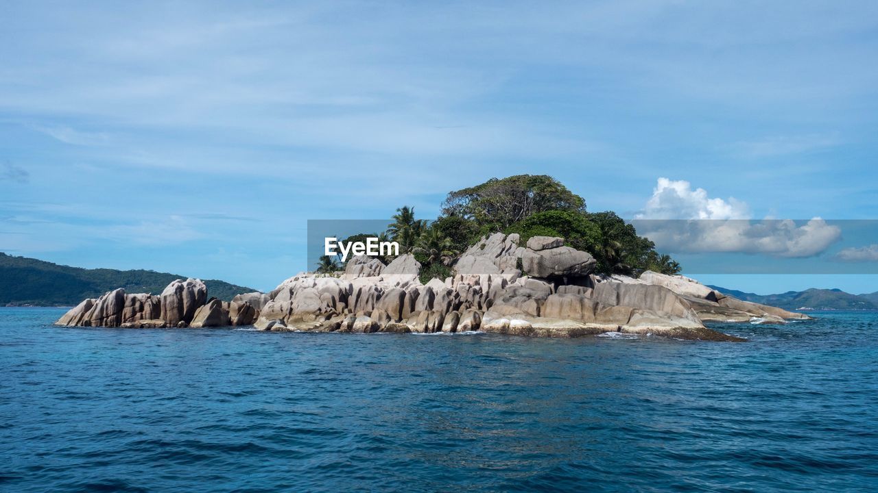 Scenic view of sea against blue sky