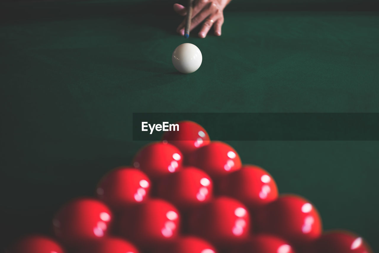 Woman playing pool at table