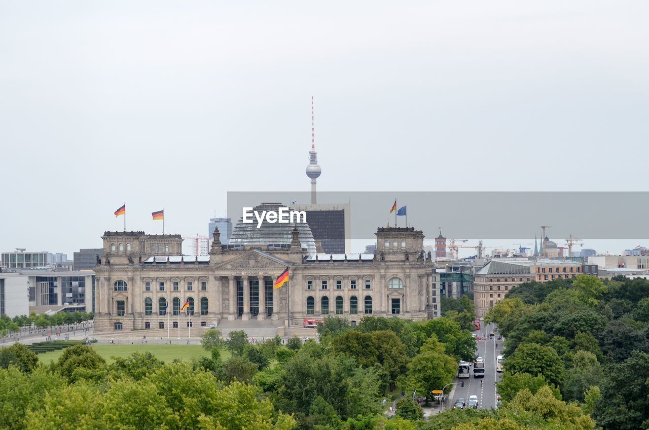 Reichstag building and fernsehturm against clear sky