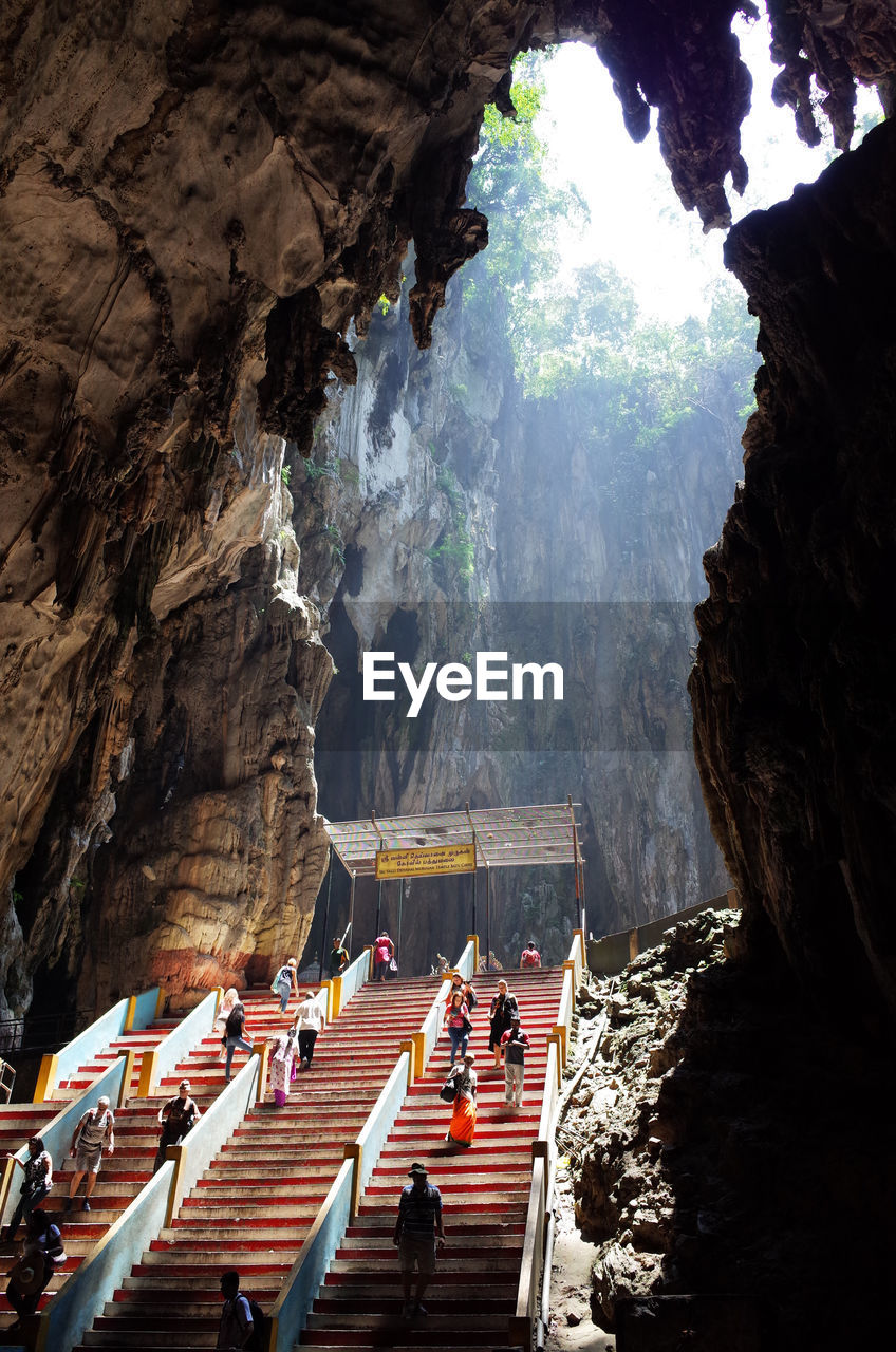 People walking on steps at batu caves