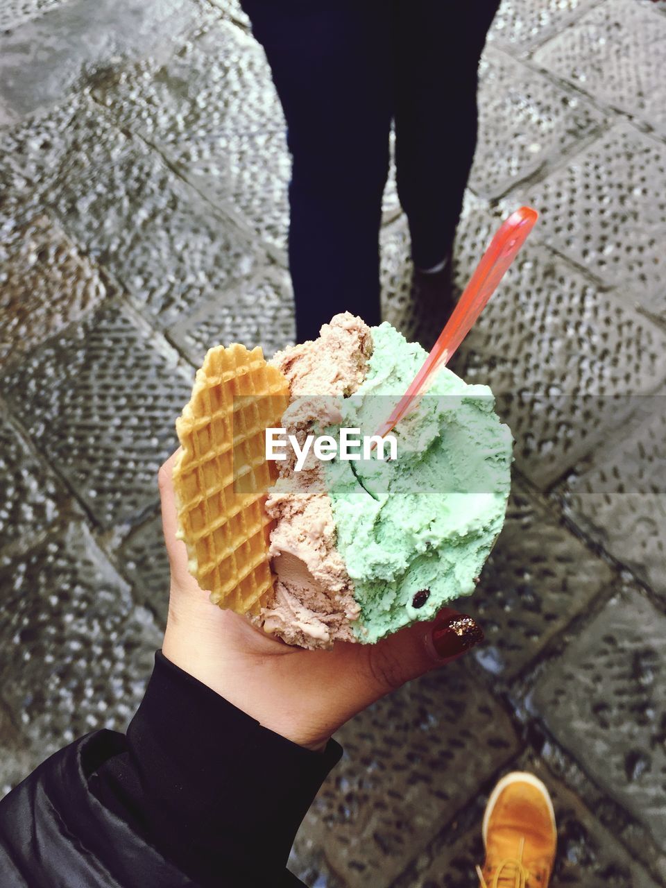 Close-up of woman holding ice cream cone