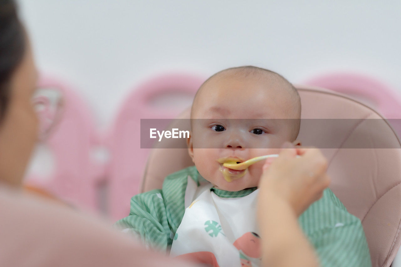 Close-up of cute girl eating food