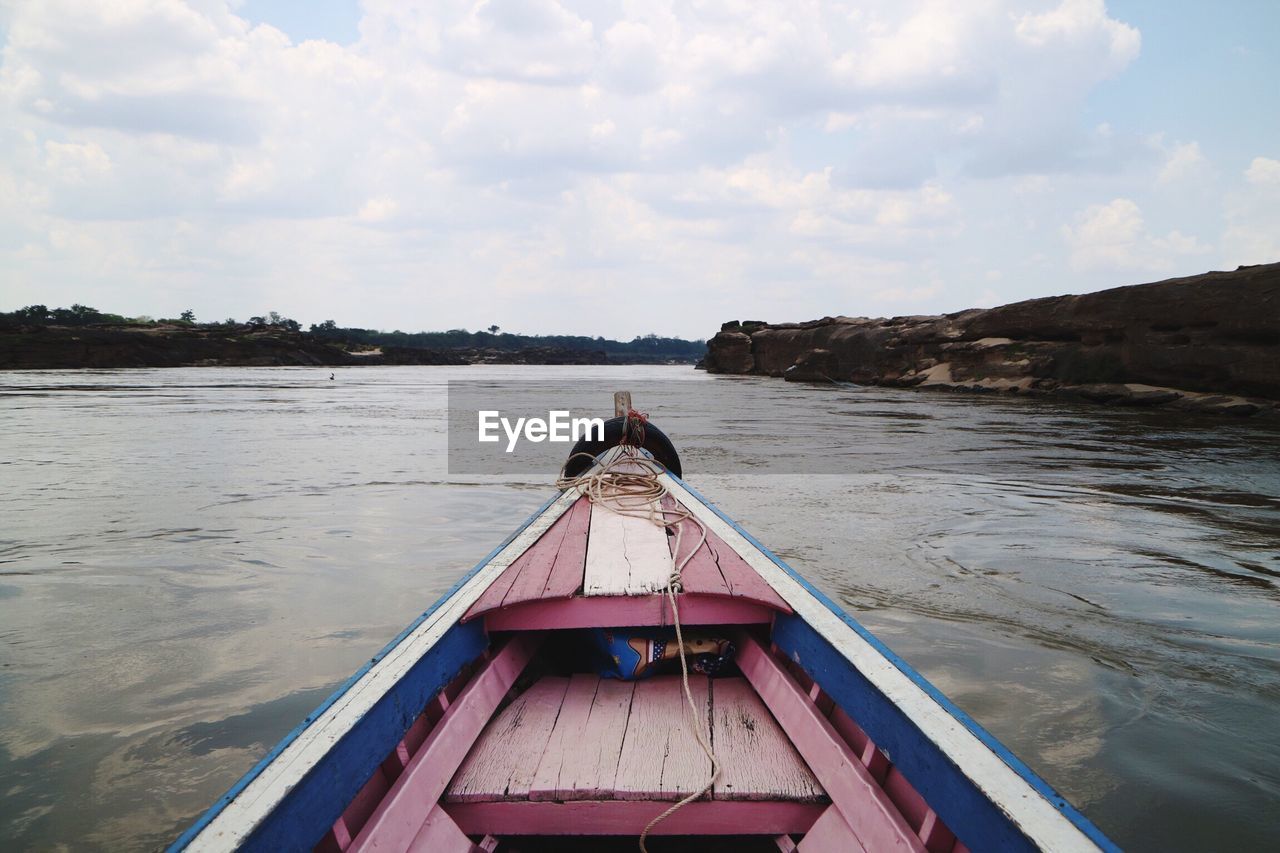 BOAT ON BEACH AGAINST SKY