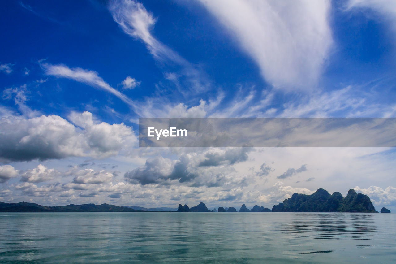 Scenic view of sea against blue sky