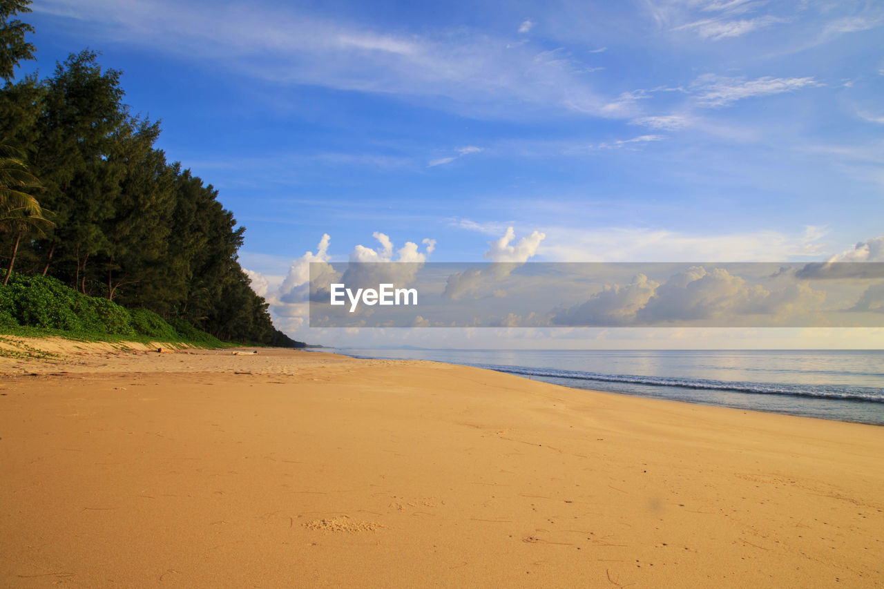 SCENIC VIEW OF BEACH AGAINST SKY DURING SUNSET